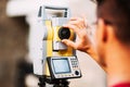 details of surveyor engineer working with total station theodolite and gps system Royalty Free Stock Photo