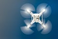 Close up details of uav drone copter flying in clear blue sky Royalty Free Stock Photo