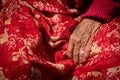 Close up details of the wrinkle hand of a elder nepalese woman