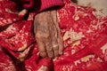 Close up details of the wrinkle hand of a elder nepalese woman