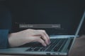 Close-up of a developer's hand typing on a laptop, input a command prompt to generate code using AI. Royalty Free Stock Photo