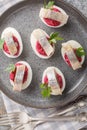 Close-up of deviled eggs with beetroot salad and herring in a plate. Vertical top view Royalty Free Stock Photo