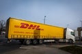 Close-up of DHL delivery company orange truck.