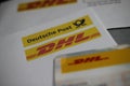 Close up of DHL, Deutsche Post correspondance and card for application to receive parcels at packstation Royalty Free Stock Photo