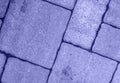 Close up of diagonal street pavement pattern toned in very peri color