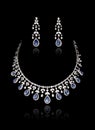 Close up of diamond necklace set on with diamond earring isolated on black Royalty Free Stock Photo