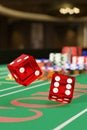 Close up of dice rolling on a craps table. Gambling concept. 3d illustration