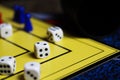 Close up of dices on yellow game board