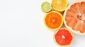 Close-up of different citrus fruits - Myers lemon, lime, mandarin, grapefruit and pomelo.