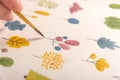 Side view of artist drawing flowers design at workplace Royalty Free Stock Photo