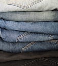 Close up of different colors jeans are stacked in an pile. Royalty Free Stock Photo