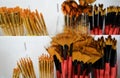 Close-up of different coral-colored paint brushes with black and red bristles. In the foreground is a fan brush. Selective focus Royalty Free Stock Photo