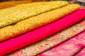 Close up of different fabric of different colors, fabric waiting for sewing clothes and other things, red, yellow fabric Royalty Free Stock Photo