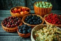 Close up different kind of baskets with fruits on vintage wood background. Red, black and white currant, green and red gooseberry Royalty Free Stock Photo