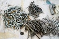 Piles of nails srews and different hardware on a drop sheet Royalty Free Stock Photo