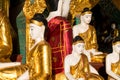 Close up of different sized golden Buddhas