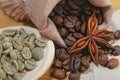 Close-up different types of coffee beans on wooden spoons, green coffee and anise star, macro, set Royalty Free Stock Photo