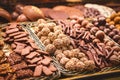 Close up. Different types of cookies in chocolate on the counter at a Spanish bazaar