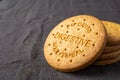 Close-up of digestive biscuits in stack, on dark tablecloth, horizontal Royalty Free Stock Photo