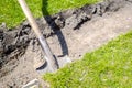 Close-up digging soil, ground, details pieces of green fresh lawn grass at city park, garden or backyard. Gardening landcaping Royalty Free Stock Photo