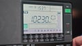 Close-up Digital LCD Scale of Modern Radio with Scanning FM Frequency