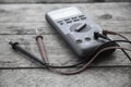 Close-up of digital multimeter on wooden background, Worker used electronic tools for checked circuit Royalty Free Stock Photo