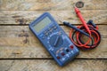 Close-up of digital multimeter on wooden background, Worker used electronic tools for checked circuit Royalty Free Stock Photo