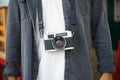 Close-up of digital photo camera on mans body