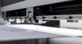 Close-up of a digital printer printing on paper in a high-tech printing facility. concept of industrial technology, advanced Royalty Free Stock Photo