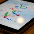 A close-up of a digital tablet displaying a mapped route in an application Royalty Free Stock Photo