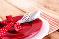 close up dinner setting fork and spoon on plate on wooden background