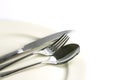 Close up dinning silverware fork , spoon and knife with dish on Royalty Free Stock Photo