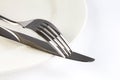 Close up dinning silverware fork , spoon and knife with dish on Royalty Free Stock Photo