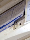 Close up dirt air conditioner filter. Danger and the cause of pneumonia and respiratory diseases in house or office