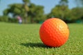 Close up dirt golf ball on grass with blurred green golf cou