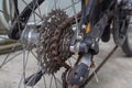 Close up of dirty bicycle rear gear and rusty chain