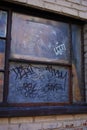 Close up of a dirty broken boarded up window sill on an abandoned building Royalty Free Stock Photo