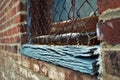 Close up of a dirty broken boarded up window sill on an abandoned building Royalty Free Stock Photo