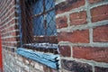 Close up of a dirty broken boarded up window sill on an abandoned building Royalty Free Stock Photo