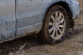 Close up dirty car with dry mud on tires Royalty Free Stock Photo