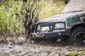 Close up of dirty off-road car with splashes of mud Royalty Free Stock Photo