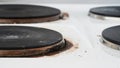 Close-up of a dirty stove with leftover food. Dirty gas stove with grease stains, old grease stains, fried stains and oil splashes Royalty Free Stock Photo