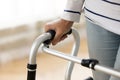 Close up disabled older woman holding hand on walker Royalty Free Stock Photo