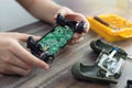 Close up of disassemble game controller repairing, cleaning or diagnostic.