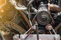 Close-up on a disassembled engine with a view of the gas distribution mechanism, chain, gears and tensioners during repair and Royalty Free Stock Photo