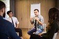 Close-up on discussion. Close-up of people communicating while sitting in circle and gesturing Royalty Free Stock Photo