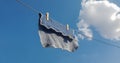 Close up on a dish washing cloth hanging from a metal wash line Royalty Free Stock Photo