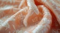 A close-up display of a Peach Fuzz brocade fabric, focusing on the rich, decorative patterns and soft peach color, fully