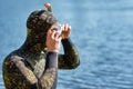 Close up of diver in wet suit with mask and snorkel prepare get ready to dive in a water Royalty Free Stock Photo