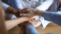 Close up diverse business people putting hands together, showing support Royalty Free Stock Photo